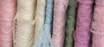 rolls of pink, white,blue, green, mauve lace